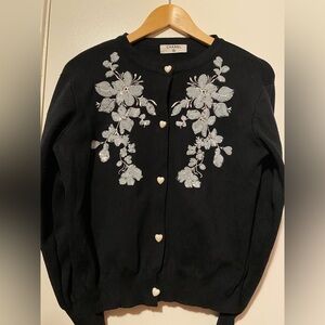 CHANEL Black Cardigan with White Floral Design